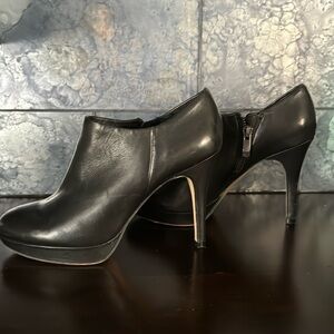 Vince Camuto leather healed booties.  Side zip, Size (61/2) or 361/2 .